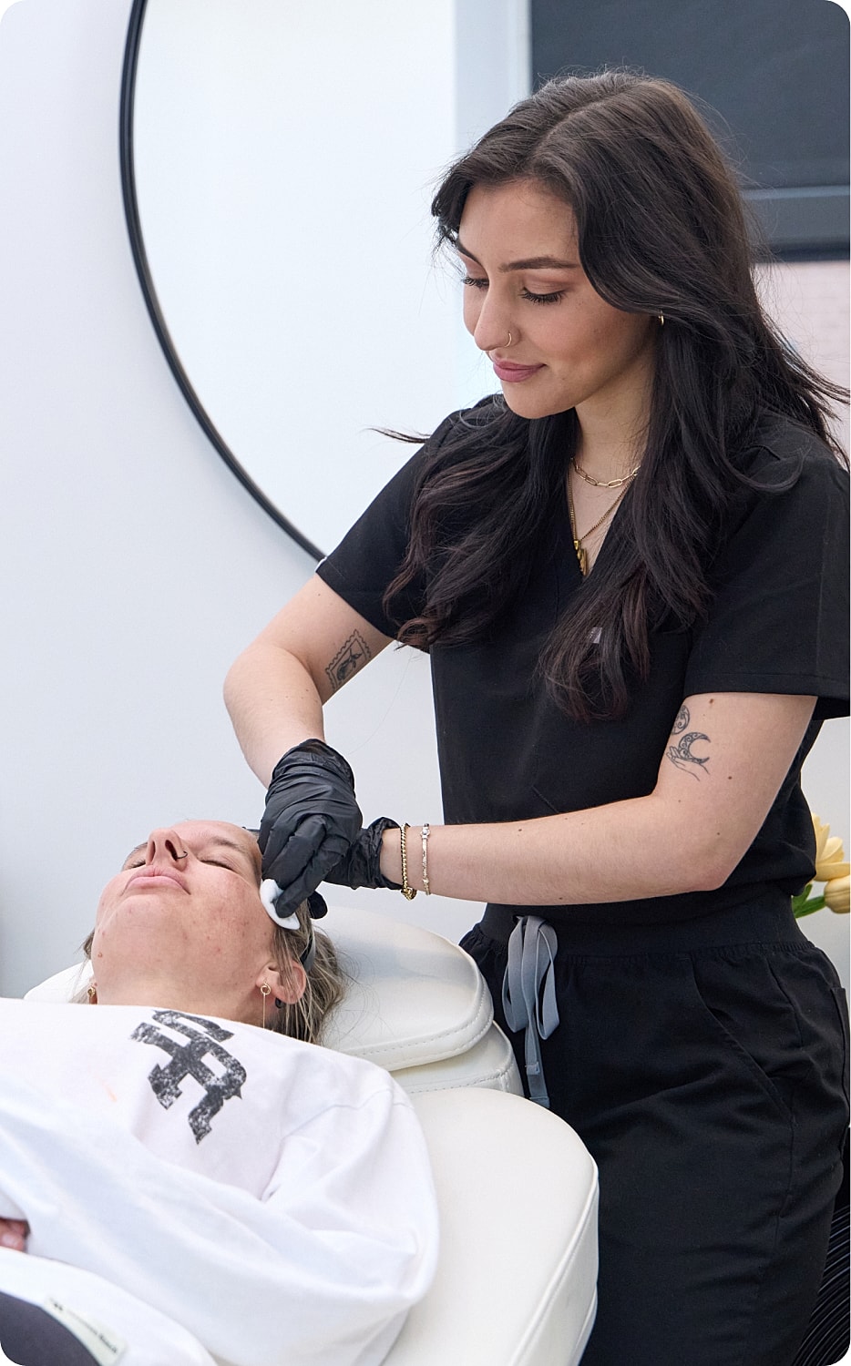 Dental consultation with patient smiling in mirror.