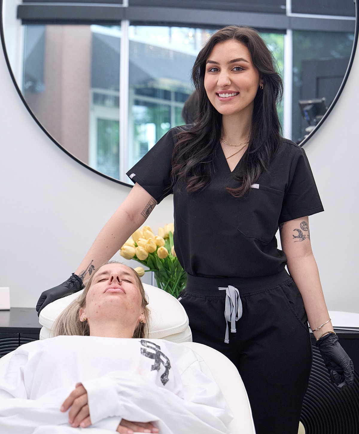 Skincare treatment being applied to woman's forehead.