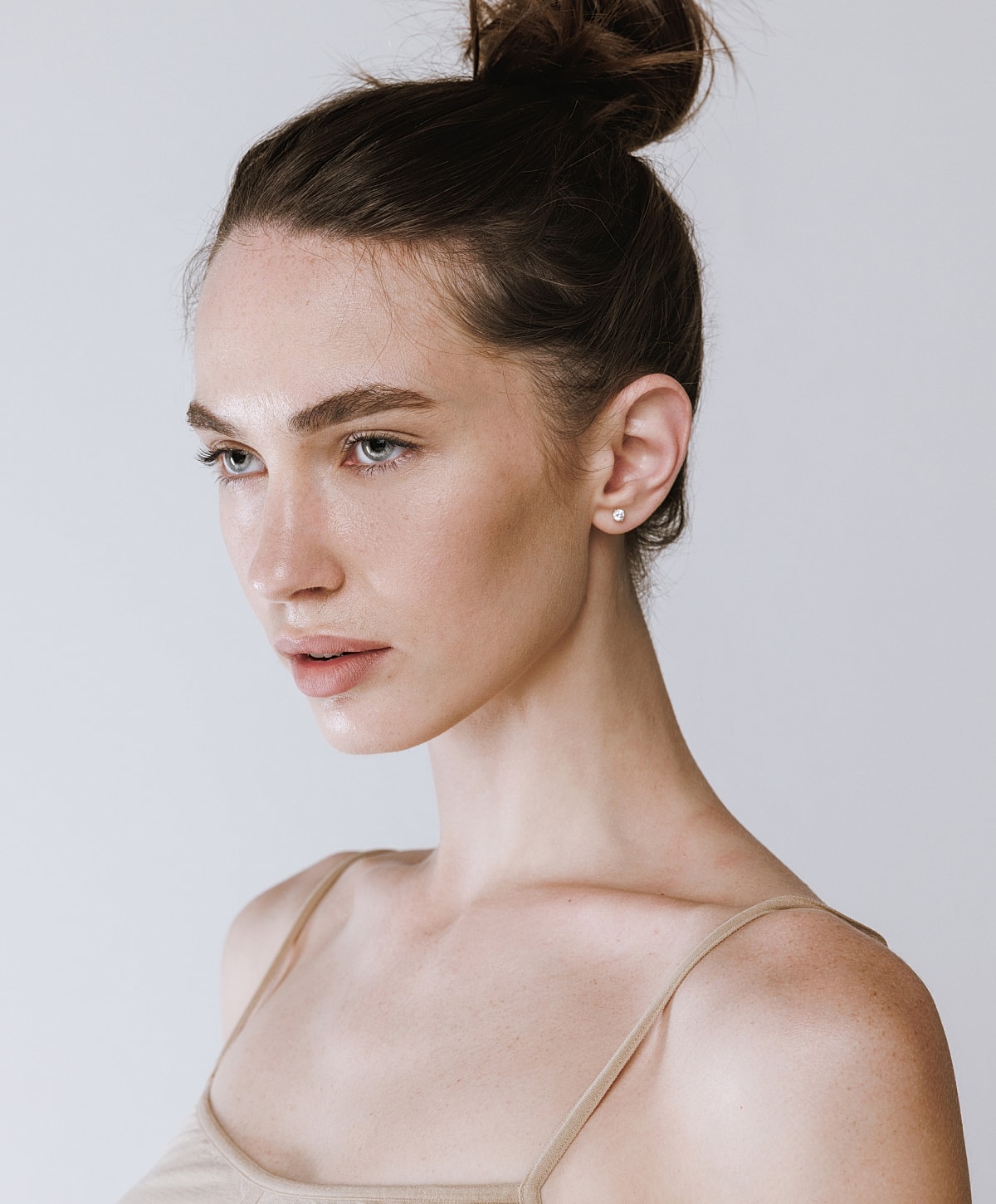 Profile of a young woman with natural makeup.