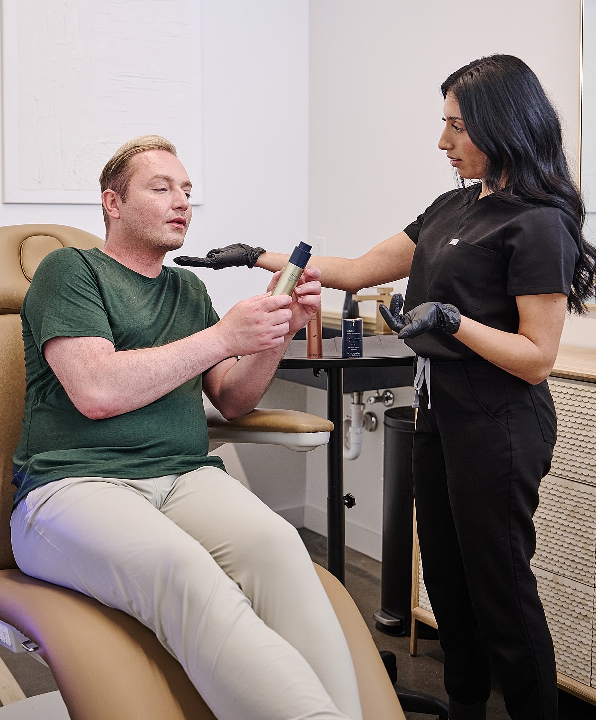 Consultation for skincare products in clinic setting.