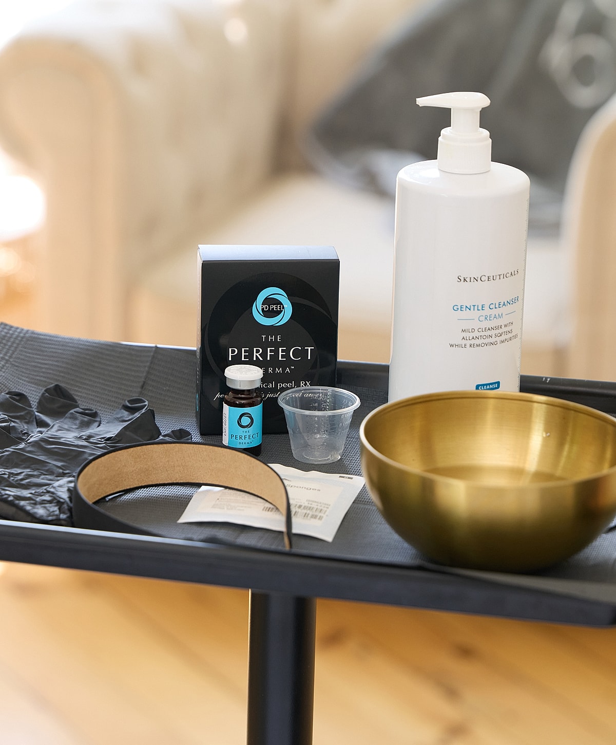 Skincare products and tools for a facial treatment.