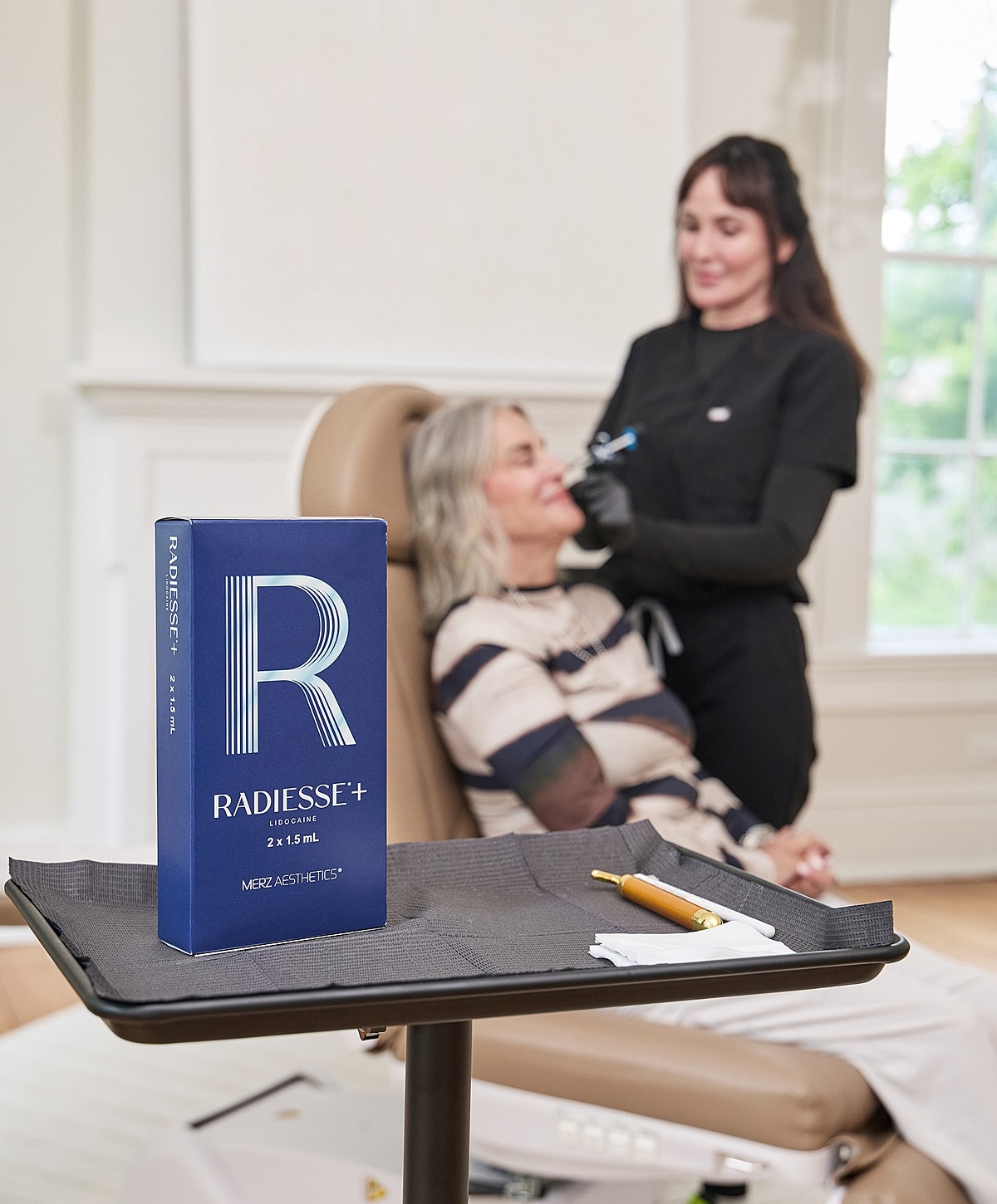 Client receiving facial treatment at beauty clinic.