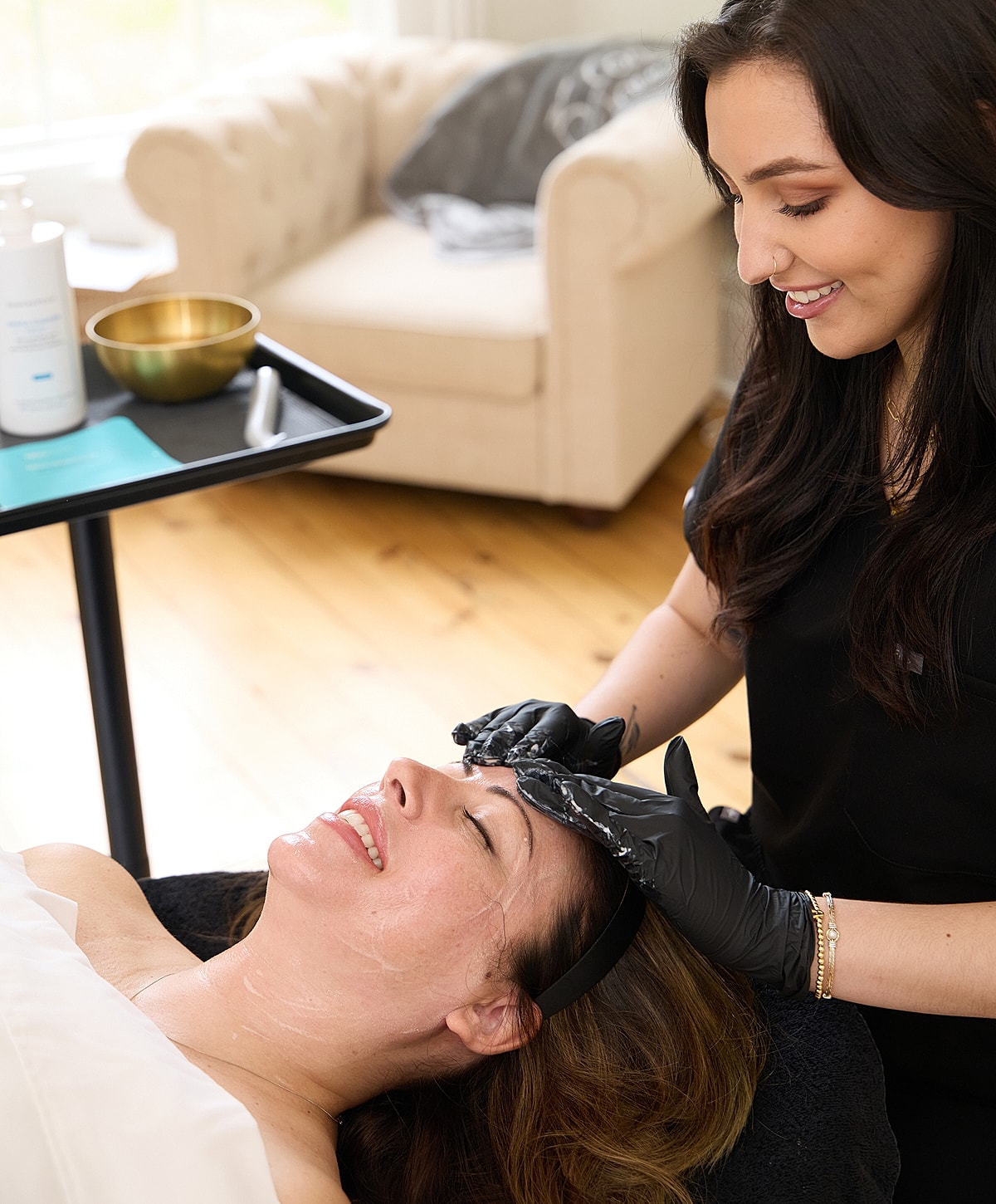 Close-up of model with glowing skin and freckles.