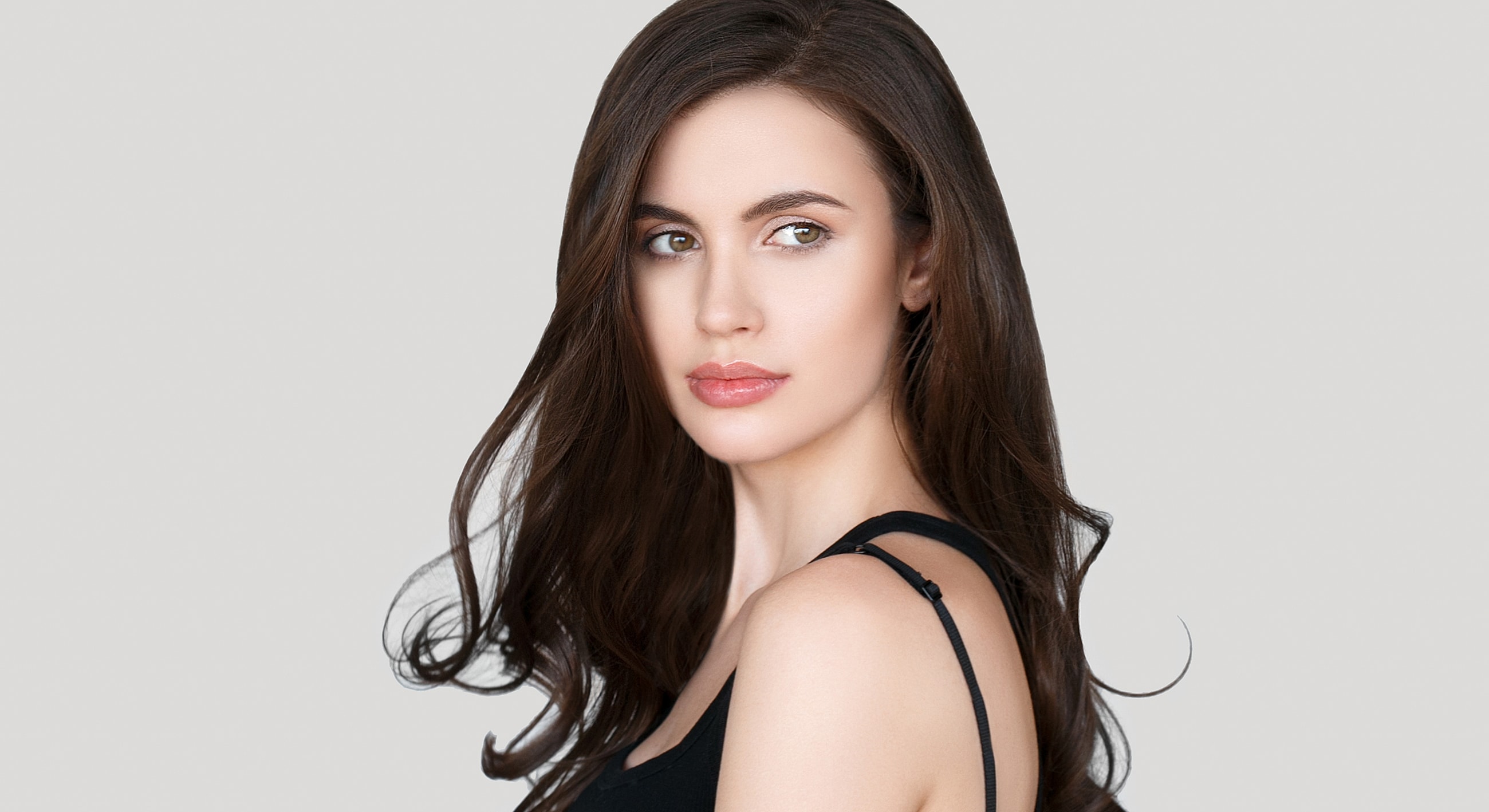 Portrait of a woman with long, flowing hair.