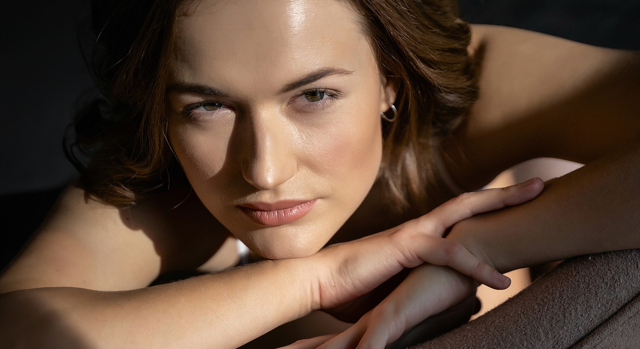 Close-up portrait of a contemplative woman.