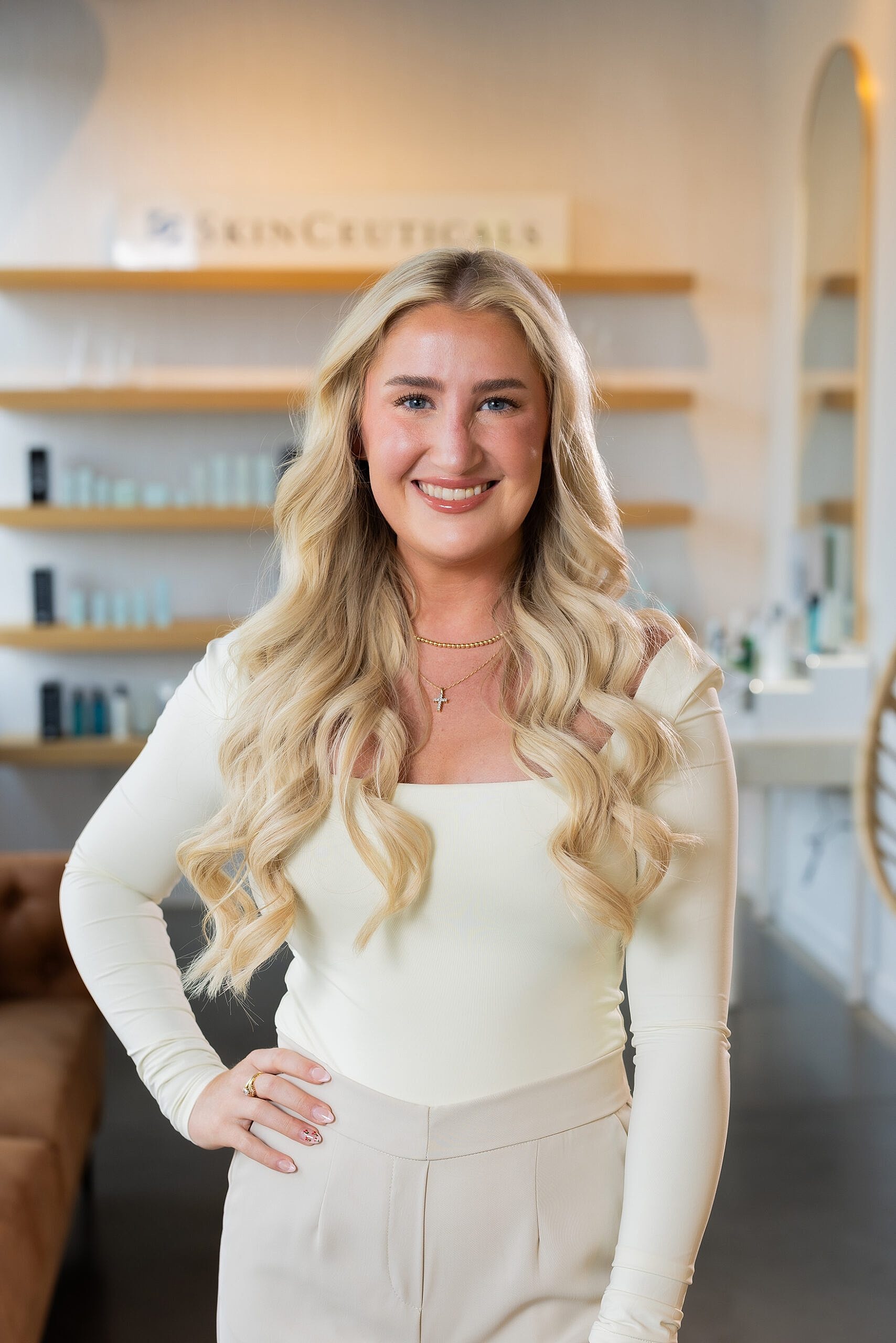 Smiling woman in a skincare clinic setting.